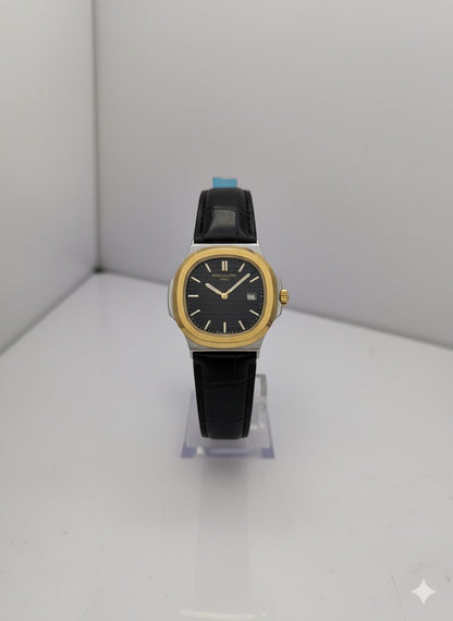 The Patek Philippe Nautilus: Gold & Steel with Black Leather Strap